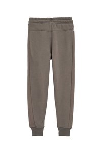 Sweatpants i en dämpad grå färg, med en avslappnad passform, ribbade ärmslut och strukturerade sidopaneler för ytterligare detaljer. Elastisk midja.