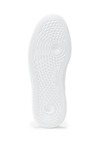 Vit gummisula med ett strukturerat zigzagmönster, cirkulära urklipp för flexibilitet och präglad varumärkeslogotyp längs sidan.