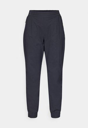 Pantalons légers bleu marine avec une coupe fuselée. Dotés d'une taille élastique et de deux poches zippées sur les côtés. Texture lisse.
