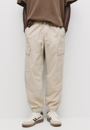 JOGGER - Cargohose - ochre