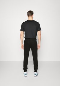 Puma HANDBALL - Trainingsbroek - black