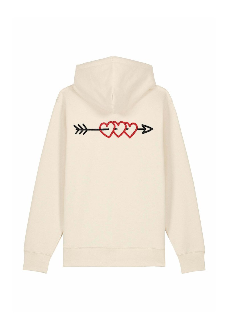 Hoodie de couleur crème avec un motif au dos représentant trois cœurs rouges sur une flèche noire. Tissu doux ; capuche ajustable ; poignets côtelés.