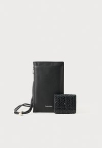 COATED EMBLEM - Handytasche - black