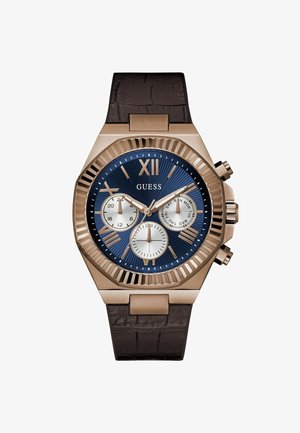 Orologio color bronzo con cinturino in pelle marrone scuro, quadrante blu con tre quadranti più piccoli e numero romano XII in alto.