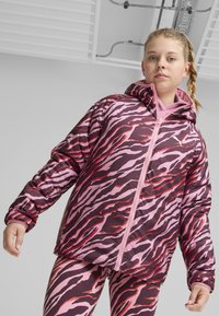 Polstret jakke med et pink og burgunder tigerstribe mønster, frontlynlås og hætte. Sammen med matchende leggings i det samme mønster.