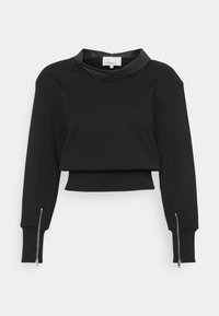 Černá zkrácená mikina s vysokým límcem, dlouhými rukávy a stříbrnými zipy na manžetách. Hladká textura látky. Minimální design.