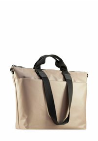 Sac fourre-tout beige avec des poignées noires, présentant une finition lisse et mate. Il est doté d'une fermeture éclair en haut et d'une poche extérieure pour un rangement supplémentaire.