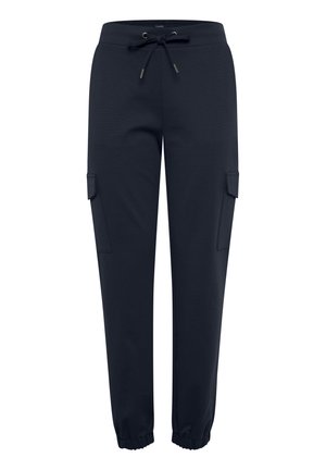 Navy sweatpants made of soft fabric, featuring an elastic waistband with drawstring, two side pockets, and tapered cuffs.