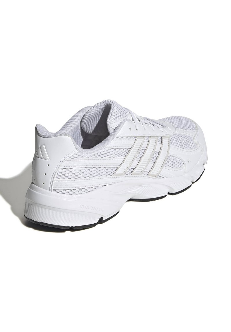 White athletic shoe with mesh upper, textured details, three-stripe design, padded collar, and rubber outsole for traction.