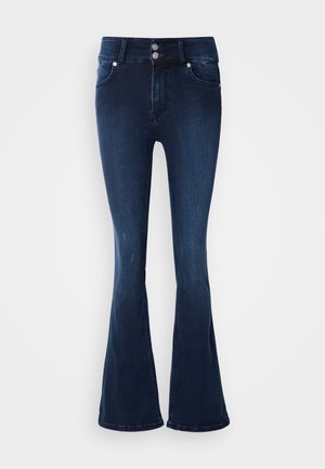 Tume sinised alt laienevad teksad kõrge vöökohaga, millel on topelt-nööpidega sulgur, viis taskut ja sile teksakangas.