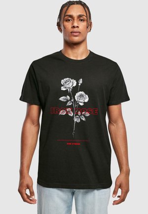 Black cotton t-shirt featuring white and red graphic of roses and text "IRON ROSE" with a smooth texture and short sleeves.