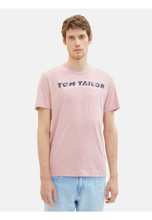 Light pink short-sleeve T-shirt featuring "TOM TAILOR" printed in dark navy and white, made from soft cotton fabric. Casual fit.