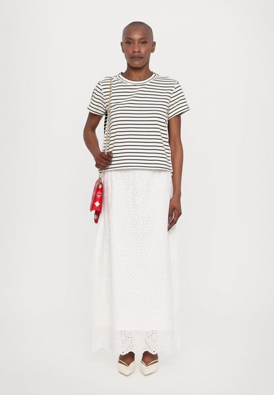 Striped short-sleeve tee, white eyelet maxi skirt, cream pointed-toe heels, and a red handbag with chain strap. Simple design, textured fabric.