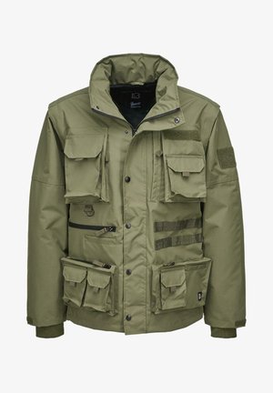 Olive green jacket featuring multiple pockets, zippers, and Velcro patches. Made of durable fabric with a structured, functional design.