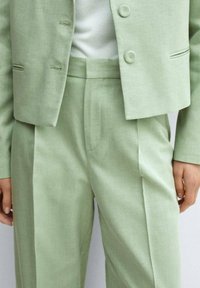 Mango Pantaloni - light green