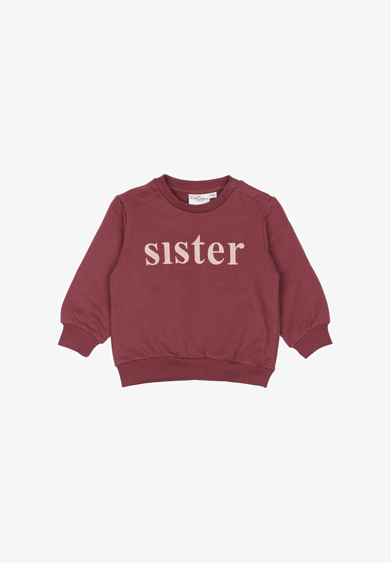 Bordó pulóver, puha anyagból készült, elöl "sister" felirattal bézs színű hímzéssel, bordázott mandzsettákkal és kerek nyakkivágással.