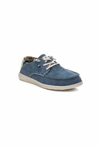 Zapato de tela azul con cordones beige, punta redondeada y suela de goma. El interior presenta un forro de patrón contrastante. Diseño sencillo con acentos laterales.