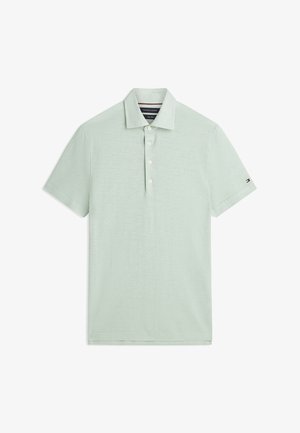 Světlounce zelené tričko typu polo s krátkými rukávy, límečkem, třemi bílými knoflíky a malým logem Tommy Hilfiger na levém rukávu.