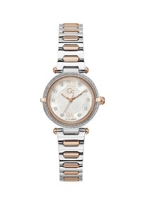 Sølv- og rosaguldfarvet ur med rund urskive, hvid tekstureret skive, romertal, krystalaccenter og en kædet metalrem.