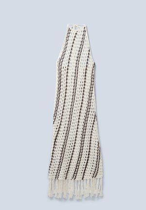 Crochet dress in white with brown stripes, featuring a sleeveless design and fringed hem. Made of lightweight yarn.