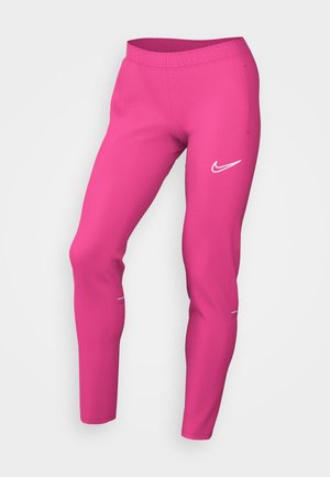 Jasnoróżowe dopasowane spodnie sportowe z elastycznym pasem, kieszeniami po bokach i białym logo Nike na górnej części uda.