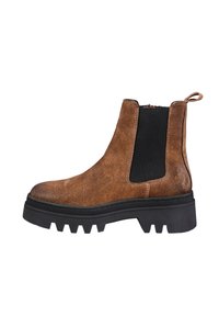 Brown suede Chelsea boots with black elastic side panels and a pull tab. Chunky black rubber sole with a textured tread for traction.
