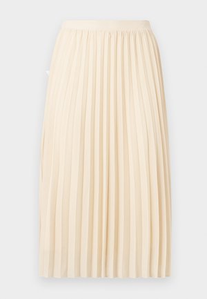 Jupe midi couleur crème avec des plis verticaux étroits et une ceinture ajustée sur un fond clair.