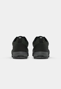 Black outdoor shoes featuring a smooth upper material, cushioned heel, textured black sole, and gray accents, designed for durability.