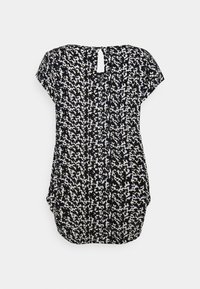 Haut à motifs noir et blanc avec des manches courtes, un col rond et un petit détail en forme de trou d serrure à l'arrière. Tissu doux et coupe décontractée.