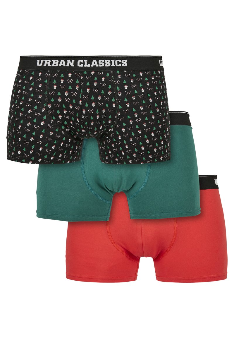 Ensemble de trois boxers : un noir avec un motif de Père Noël et d'arbres, un vert et un rouge. Tous comportent une taille noire avec "URBAN CLASSICS".