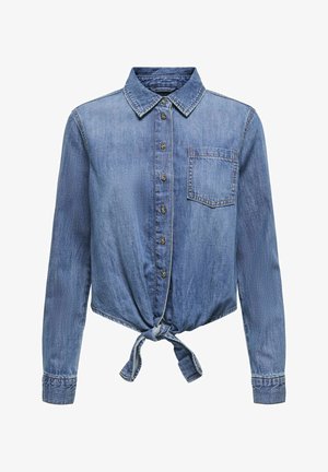 Sinine teksashirt pikkade varrukatega, tagasihoidliku nööpidega esiosa ja sõlme detailiga alusservas. Omab ühte rinna taskut ja kraega kaelust.