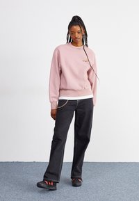 Carhartt WIP AMERICAN SCRIPT - Mikina - glassy pink