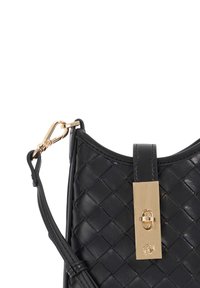 Black leather handbag with a woven texture, featuring a gold-tone clasp and a detachable shoulder strap. Smooth accents complete the design.