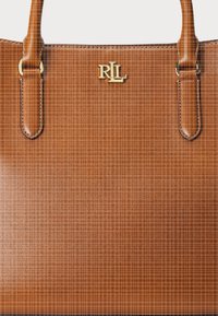 Brown leather tote bag with a smooth texture, featuring two top handles and a gold "RL" logo on the front. Simple design, no patterns.