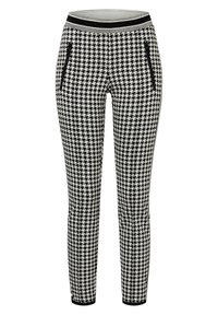 Schackrutiga leggings i svart och vitt med ett tjockt svart midjeband och två fickor med dragkedja på sidorna. Stretchigt tyg för komfort.