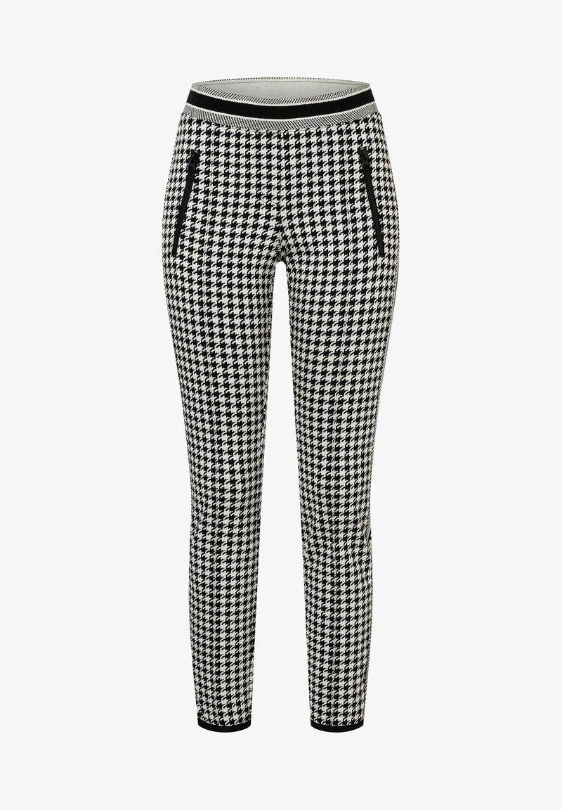 Schackrutiga leggings i svart och vitt med ett tjockt svart midjeband och två fickor med dragkedja på sidorna. Stretchigt tyg för komfort.