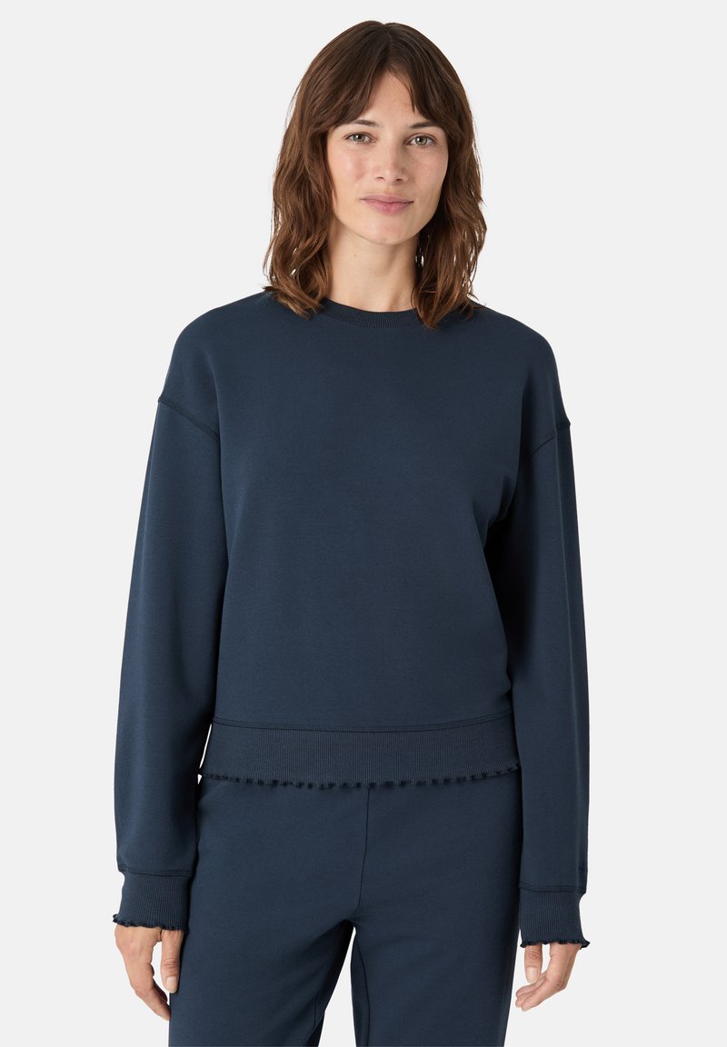 Námořnická modrá mikina s dlouhými rukávy, ribbovaný límec a lem, s třepeným akcentem na manžetách a spodním okraji.