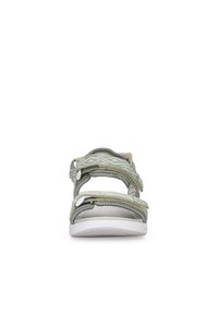 Green fabric sandals with adjustable straps, white rubber sole, and geometric pattern on strap. Features a cushioned footbed for comfort.