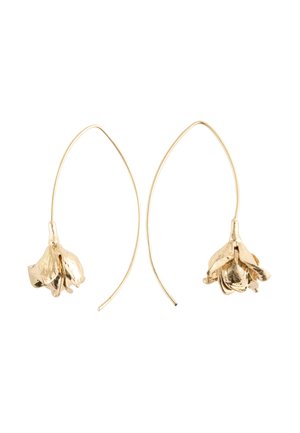 Gold-tone floral drop earrings with delicate hanging flower charms and elongated curved hooks on a white background.