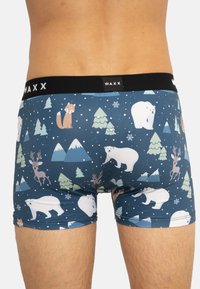 Boxers en tissu bleu foncé avec un motif de faune hivernale, comprenant des ours polaires, des renards, des rennes et des montagnes. Taille noire.