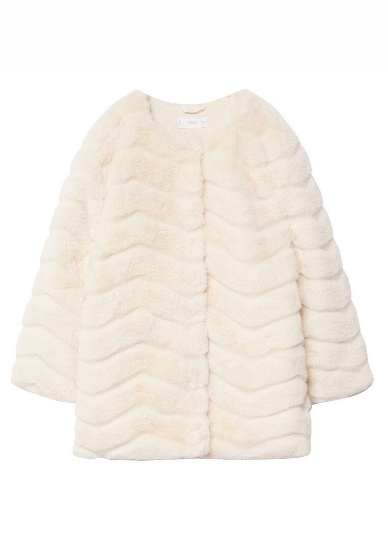 Cream-colored faux fur coat with a chevron pattern, round neck, and wide sleeves, featuring soft, fluffy texture and no visible hardware.