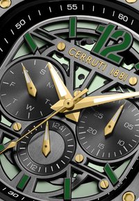 Orologio Cerruti 1881 con quadrante scheletrato verde e nero, accenti dorati, indici delle ore affilati e tre sottodial per le funzioni cronografiche.