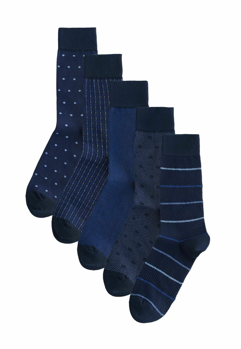 Five pairs of navy blue socks with varied patterns including polka dots, stripes, and textured designs, arranged in a staggered row.