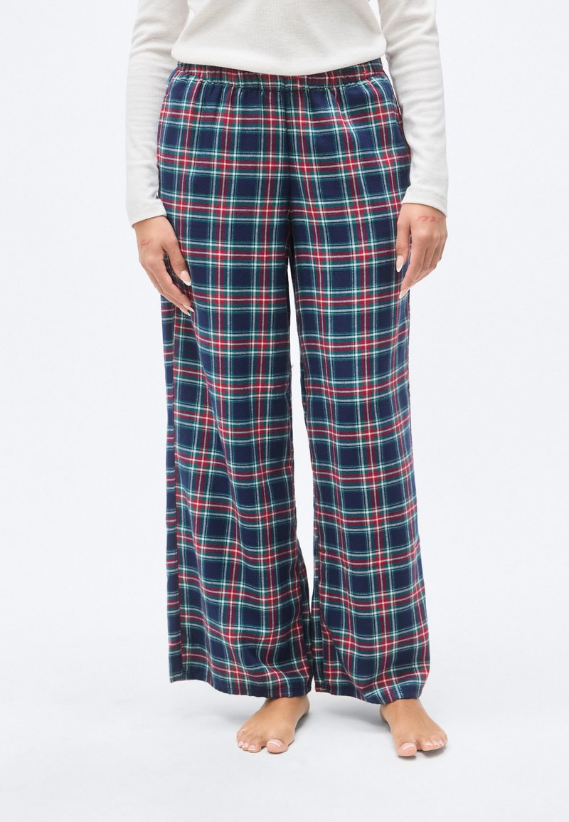 Παντελόνι πιτζάμας με καρό σχέδιο και ελαστική μέση, με μοτίβο σε μπλε, κόκκινο και πράσινο, φαρδιές μπατζάκια και απαλό ύφασμα.