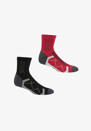 Pair of mid-length sports socks, one black with gray accents, one red with gray and white details, both with a brand logo on the cuff.