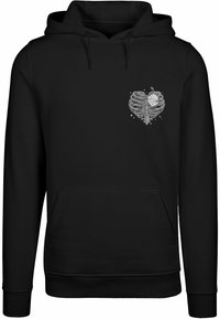 Felpa nera con una grafica di un cuore a forma di gabbia toracica con una rosa, tasca frontale, cappuccio con cordino e polsini a costine.