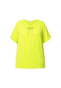 Blusa verde lime con maniche corte, scollatura a V e dettaglio con un fiocco legato al collo. Tessuto morbido e leggero con una vestibilità comoda.