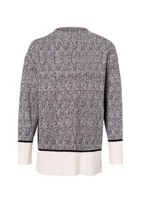 Fekete-fehér mintás pulóver herringbone mintával, bordázott aljjal és hosszú ujjakkal. Puha tapintású, enyhén rugalmas.