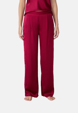 Pantalones de pierna ancha y seda en un profundo color burdeos. Presentan una cinturilla suave y detalles de plisado, con un diseño elegante y fluido.