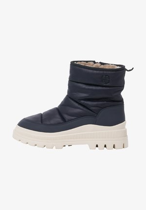 Marineblaue isolierte Winterstiefel mit einem gepolsterten Design, einem Kunstfellfutter und einer klobigen, weißen Gummisohle mit strukturierter Profilierung.